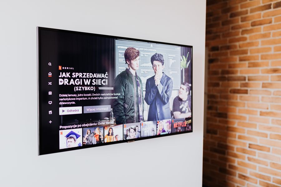 A decoder connected to a wall-mounted smart TV