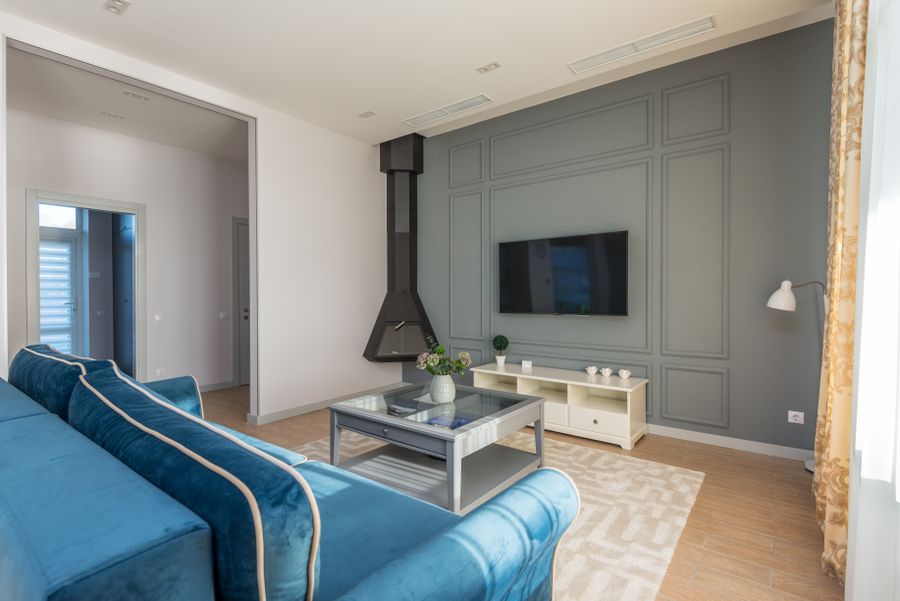 A second lounge with its own wall-mounted television